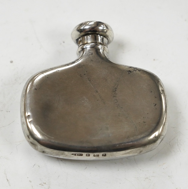 A late Victorian small silver hip flask, by Saunders & Shepherd, Birmingham, 1900, width 62mm. Condition - poor to fair